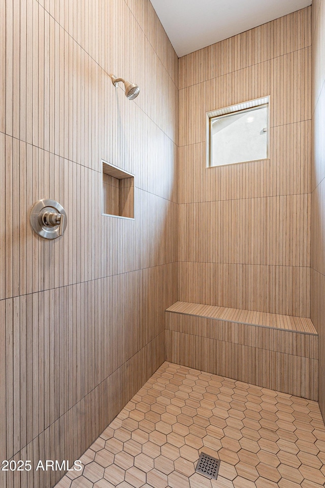 bathroom with a tile shower