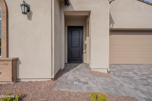 entrance to property featuring a garage