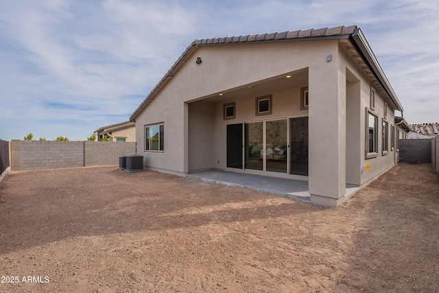 back of house featuring cooling unit and a patio area