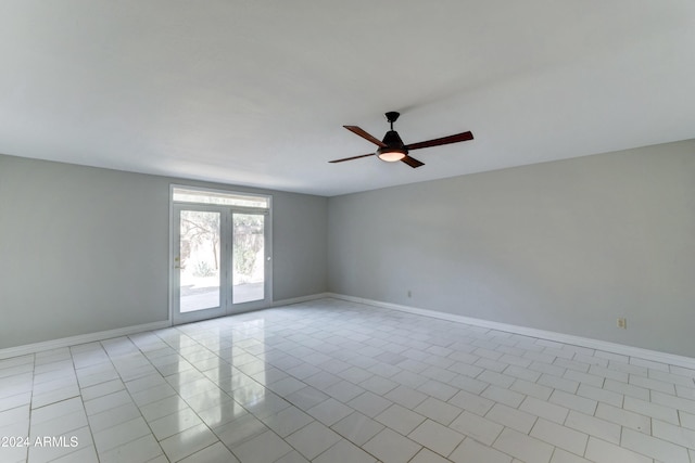 tiled empty room with ceiling fan