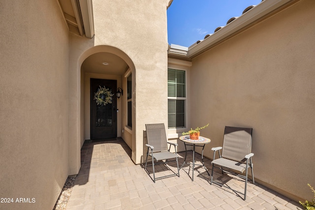 doorway to property with a patio