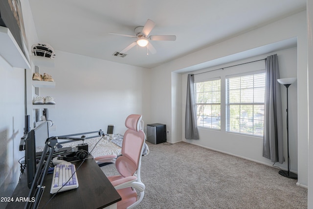 office space with baseboards, carpet flooring, visible vents, and a ceiling fan