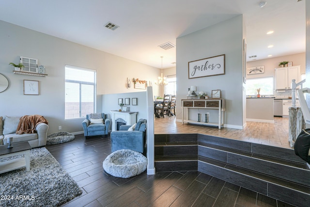 living area featuring wood finish floors, visible vents, and recessed lighting