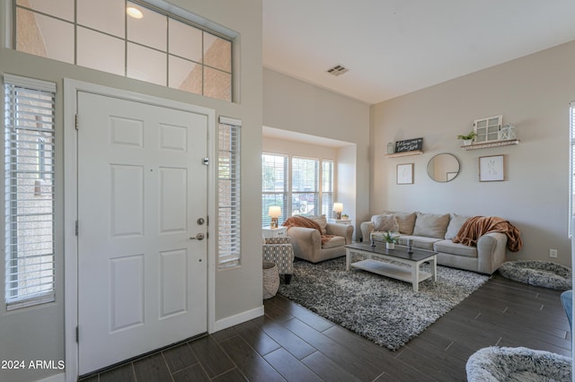 entryway featuring dark wood-style floors and visible vents