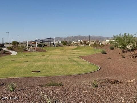 25461 W Graham Trl, Buckeye, AZ 85326 - view of community featuring a mountain view and a lawn