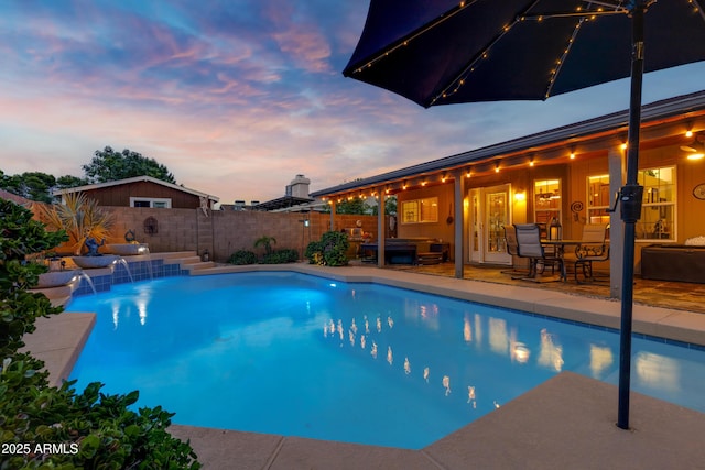view of pool with a fenced backyard, an outdoor living space, a patio, and a fenced in pool