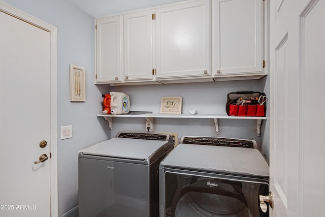 clothes washing area with cabinet space and washer and clothes dryer