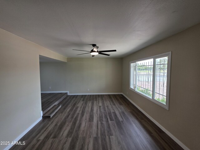 3849 W Mauna Loa Ln, Phoenix, AZ 85053 - empty room with baseboards, dark wood-style floors, and ceiling fan