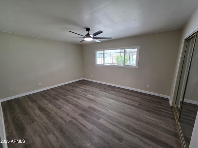 3849 W Mauna Loa Ln, Phoenix, AZ 85053 - unfurnished bedroom featuring baseboards, dark wood-style floors, a closet, and a ceiling fan