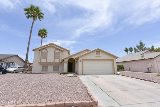 1219 E Avenida Isabela, Casa Grande, AZ 85122 - view of front of house featuring an attached garage, concrete driveway, and stucco siding
