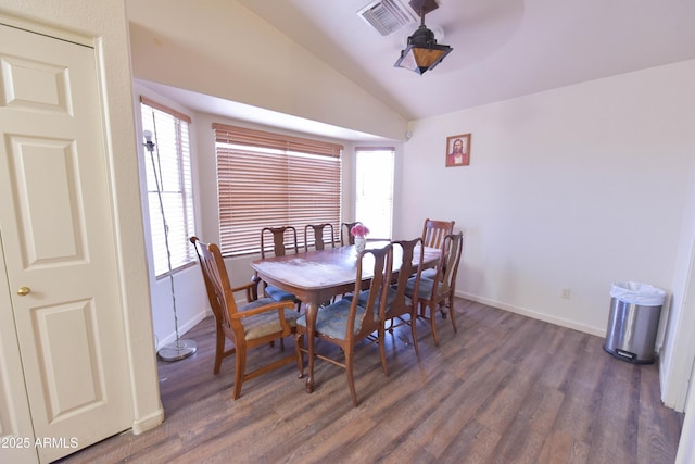 1219 E Avenida Isabela, Casa Grande, AZ 85122 - dining space featuring lofted ceiling, wood finished floors, and baseboards