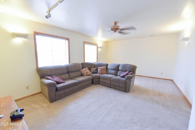1219 E Avenida Isabela, Casa Grande, AZ 85122 - living room featuring carpet flooring, a ceiling fan, and baseboards