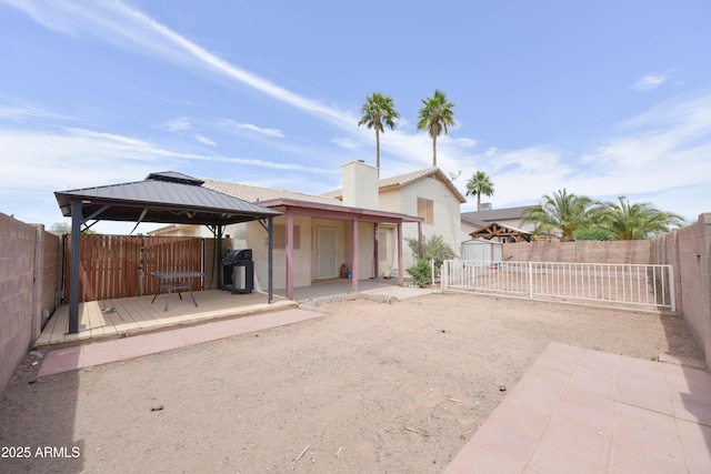 1219 E Avenida Isabela, Casa Grande, AZ 85122 - back of property with a gazebo, a fenced backyard, stucco siding, and a patio