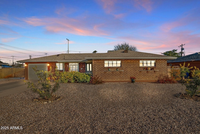 ranch-style house featuring a garage