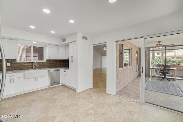 kitchen with backsplash, white cabinets, ceiling fan, sink, and dishwasher