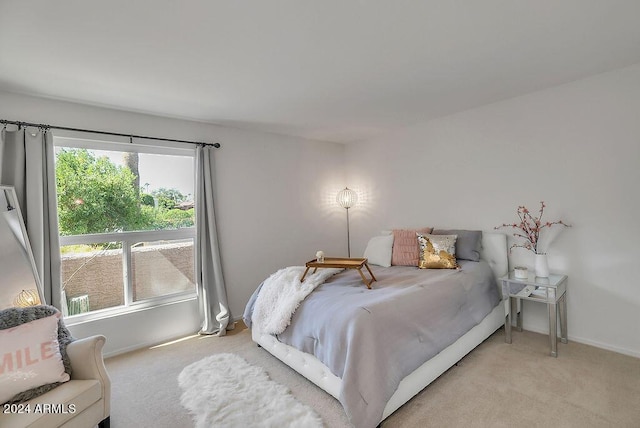 bedroom with light colored carpet