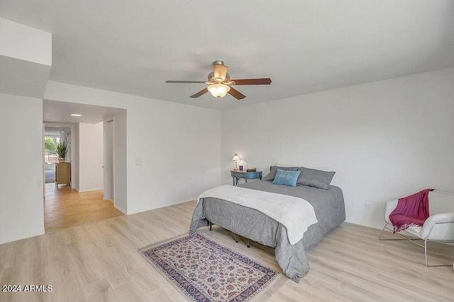 bedroom featuring ceiling fan and light hardwood / wood-style flooring