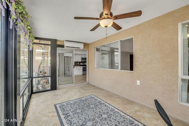 interior space featuring a wall mounted AC and ceiling fan