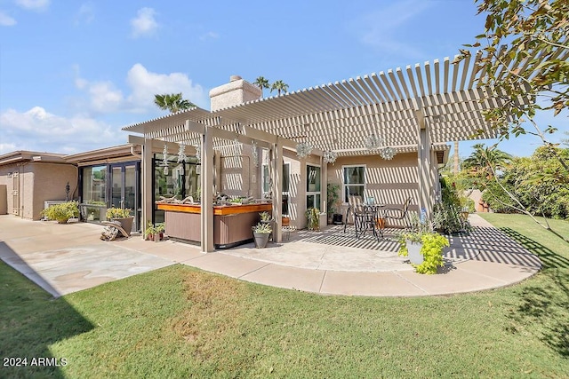 rear view of property with a patio, a pergola, a hot tub, and a lawn