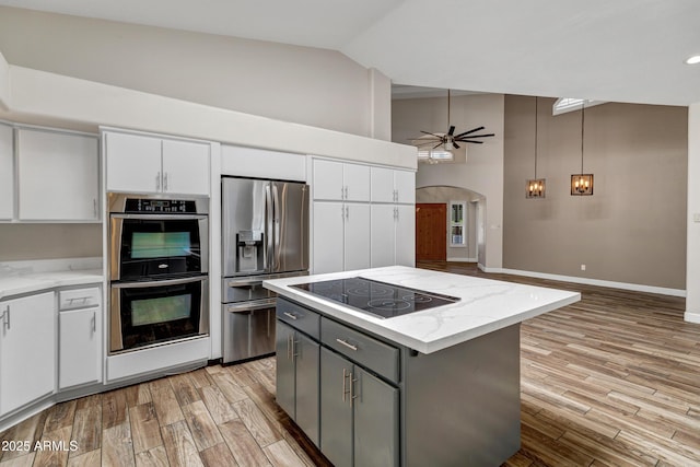 5345 E Mclellan Rd Unit 123, Mesa, AZ 85205 - kitchen featuring appliances with stainless steel finishes, white cabinets, high vaulted ceiling, a ceiling fan, and light wood finished floors