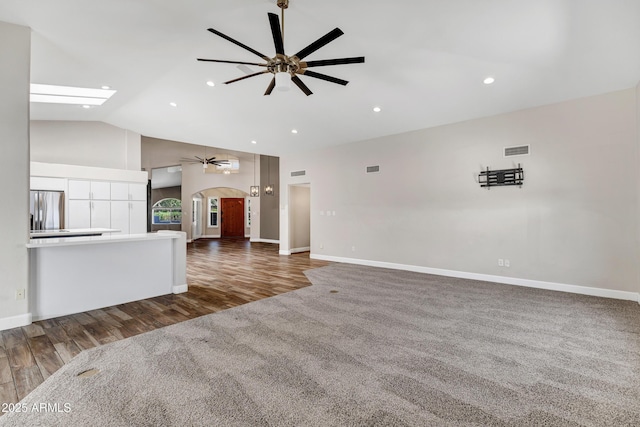 5345 E Mclellan Rd Unit 123, Mesa, AZ 85205 - unfurnished living room with ceiling fan, arched walkways, wood finished floors, baseboards, and recessed lighting