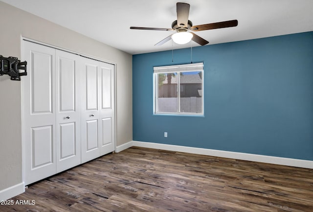5345 E Mclellan Rd Unit 123, Mesa, AZ 85205 - unfurnished bedroom featuring dark wood finished floors, a closet, baseboards, and a ceiling fan