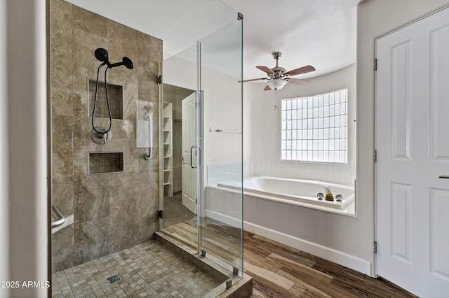 5345 E Mclellan Rd Unit 123, Mesa, AZ 85205 - bathroom with a stall shower, a ceiling fan, a garden tub, wood finished floors, and baseboards