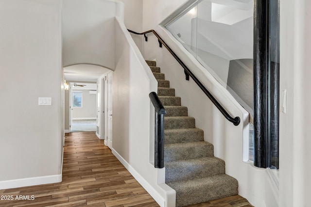 5345 E Mclellan Rd Unit 123, Mesa, AZ 85205 - stairs featuring wood finished floors, baseboards, and arched walkways