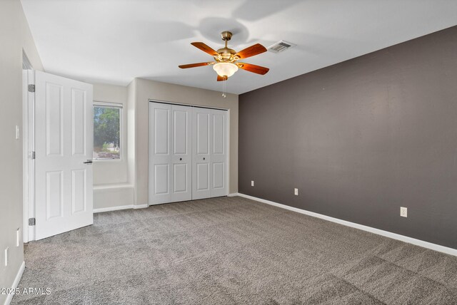 5345 E Mclellan Rd Unit 123, Mesa, AZ 85205 - unfurnished bedroom featuring carpet floors, baseboards, a closet, and a ceiling fan