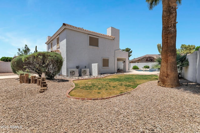 5345 E Mclellan Rd Unit 123, Mesa, AZ 85205 - rear view of house featuring a fenced backyard, stucco siding, and a chimney