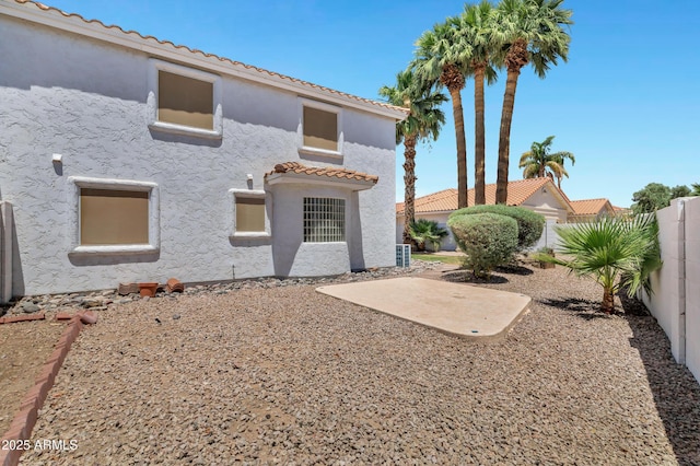 5345 E Mclellan Rd Unit 123, Mesa, AZ 85205 - rear view of property with stucco siding, a tile roof, a fenced backyard, and a patio