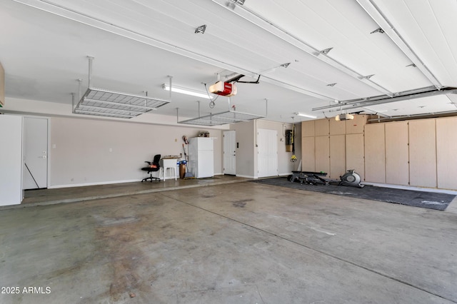 5345 E Mclellan Rd Unit 123, Mesa, AZ 85205 - garage featuring a garage door opener and freestanding refrigerator