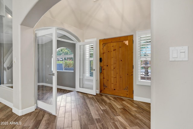 5345 E Mclellan Rd Unit 123, Mesa, AZ 85205 - entryway featuring wood finished floors, baseboards, arched walkways, and lofted ceiling