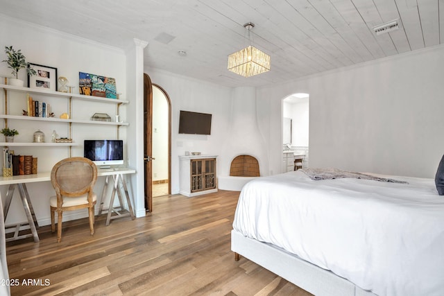 bedroom with crown molding, hardwood / wood-style floors, and wooden ceiling