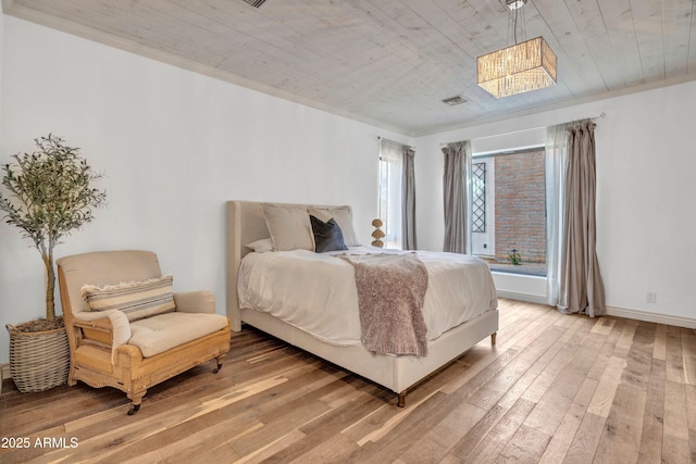 bedroom with hardwood / wood-style floors