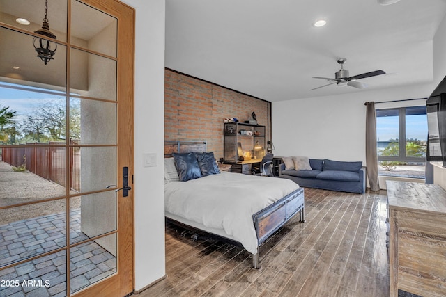 bedroom with ceiling fan and hardwood / wood-style floors