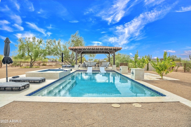 view of swimming pool with a gazebo, a patio area, and an in ground hot tub