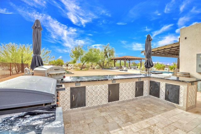 view of patio featuring area for grilling and a gazebo