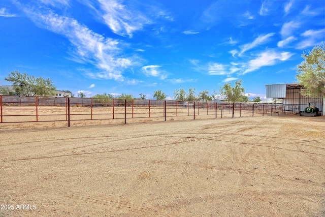 view of yard with a rural view