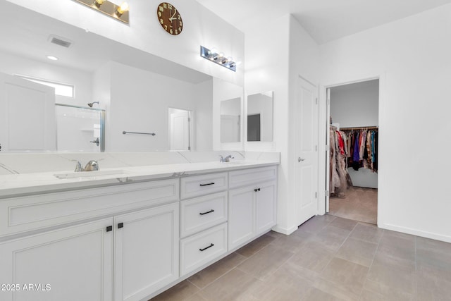 550 E Zion Pl, Chandler, AZ 85249 - full bathroom with double vanity, a walk in shower, and a spacious closet