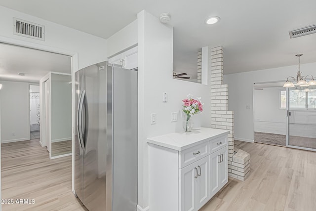 6051 E Ensenada St, Mesa, AZ 85205 - bathroom featuring wood finished floors, vanity, baseboards, and a chandelier