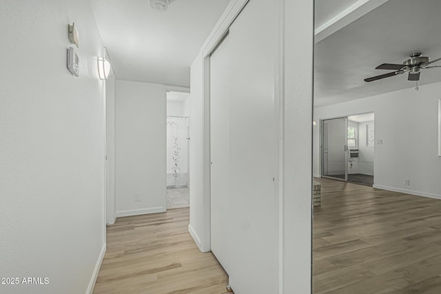 6051 E Ensenada St, Mesa, AZ 85205 - hallway with light wood-type flooring and baseboards