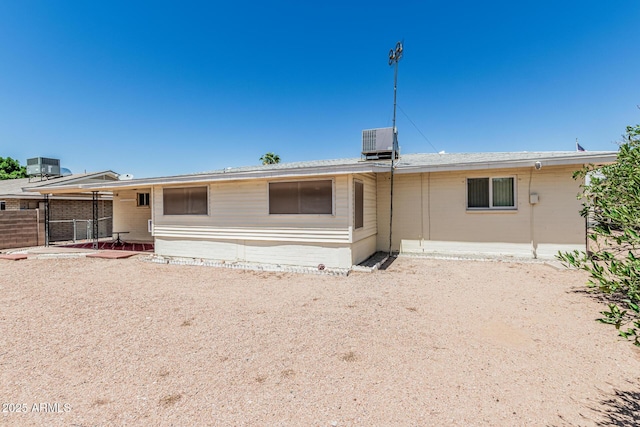 6051 E Ensenada St, Mesa, AZ 85205 - back of house featuring central AC unit
