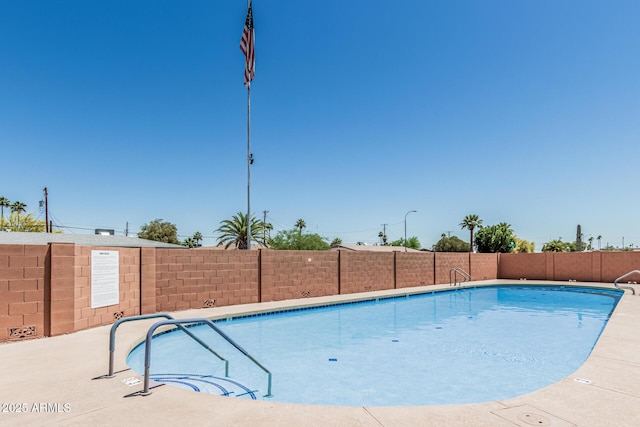 6051 E Ensenada St, Mesa, AZ 85205 - community pool featuring a fenced backyard