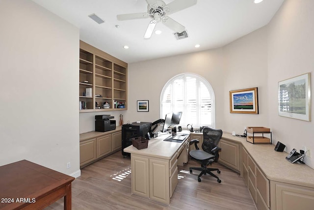 home office featuring light hardwood / wood-style floors and ceiling fan