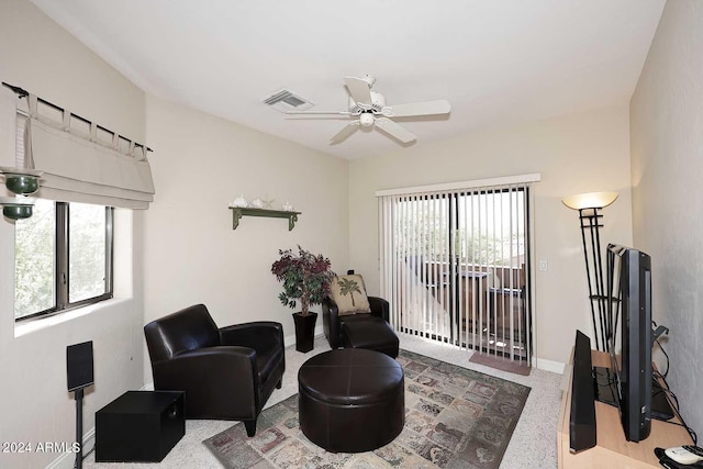 living area with ceiling fan