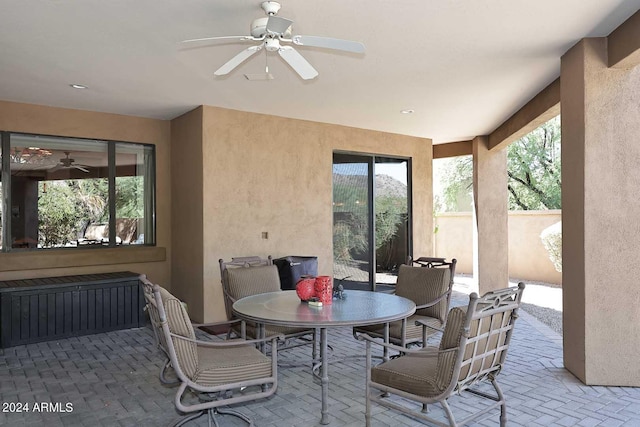 exterior space with ceiling fan