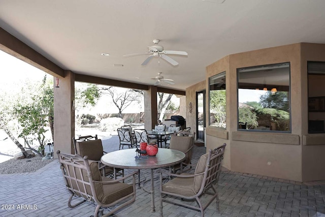 exterior space featuring ceiling fan