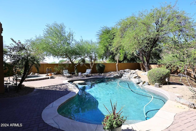 view of pool featuring a patio