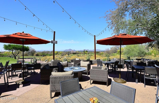 view of patio / terrace featuring a mountain view